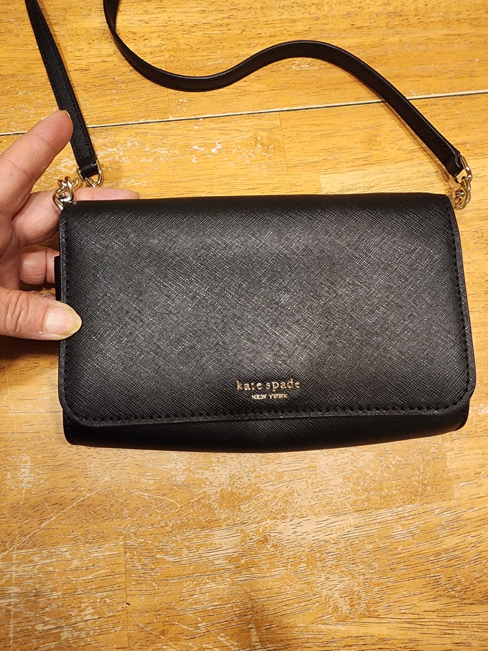 kate spade black crossbody wallet with gold logo